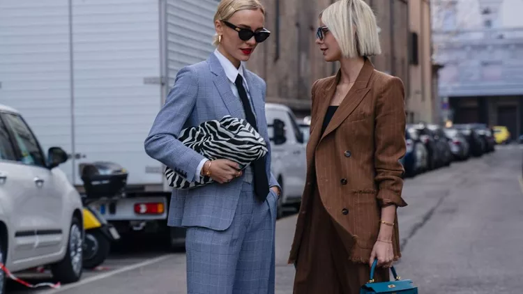 Milan, Italy - 20 February 2020: Stylish persons are posing for photographers before Max Mara fashion show on Milan Woman's Fashion Week F/W2020-2021, street style